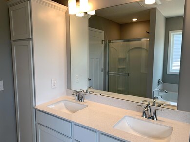 With a great soaking tub to relax and a walk-in shower for when you are on the go there is plenty of space in the en-suite. Model photo.
