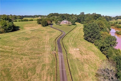 Long Private Asphalt driveway to main home