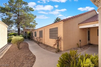 View of property exterior featuring stucco siding and a tile roof