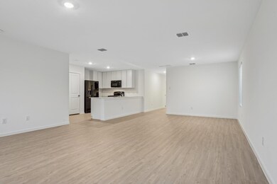 Unfurnished living room featuring light wood-type 