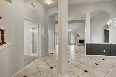 The first room beyond the entry is your formal dining room, here to the right. The bonus room is opposite, with the French doors shown. The high ceilings make everything feel so spacious!