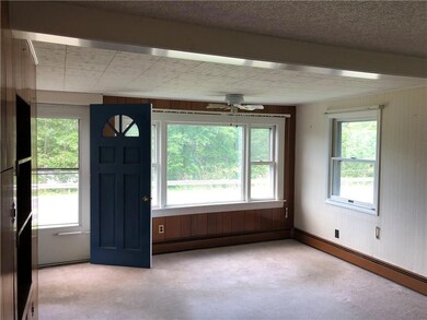 The living room with ceiling fan,...