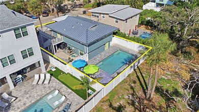 Aerial perspective of suburban area featuring a pool area and property boundaries highlighted- Virtually Edited Image