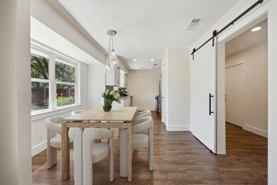 Dining room with a barn door, dark wood finished 