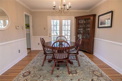 Pretty dining room with French door to deck.
