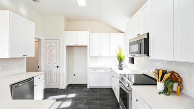 With sparkling stainless steel appliances, this ki