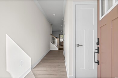 Hallway featuring light wood-type flooring