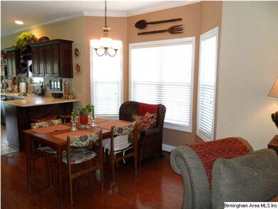 A bay window accents the dining area.