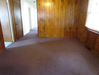 The dining area has an exterior door leading to the back patio