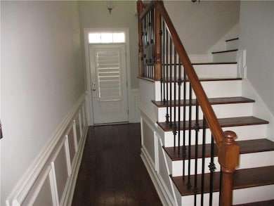 Stairs with a decorative wall, a wainscoted wall, 