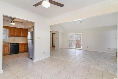 Unfurnished living room featuring light tile patte