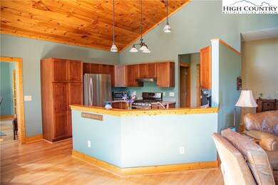 kitchen opens to dining and living areas