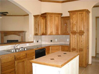 Kitchen. Built in pantry, tiled granite countertop