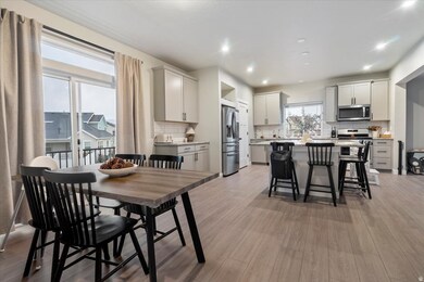 Dining room featuring light wood finished floors and recessed lighting