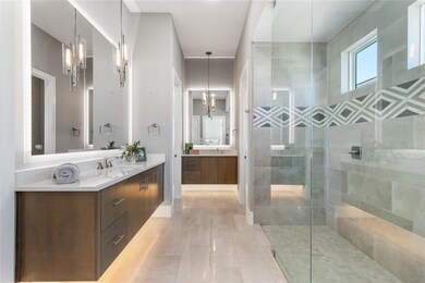 Primary Bathroom with double vanities and exquisit