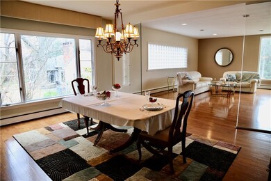 Soaring windows flood this room with light.