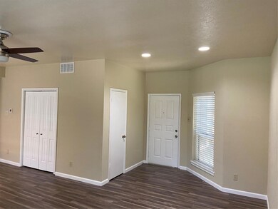 Family room with dark hardwood / wood-style floors
