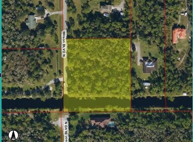 Aerial map of property and surrounding area featuring property parcel outlined