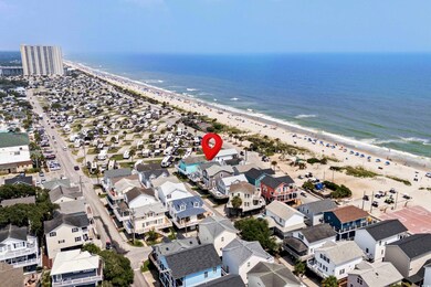 Aerial view featuring a water view and a view of t