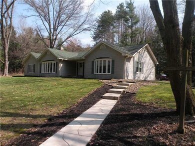 Exterior Front. Concrete driveway leading to concr