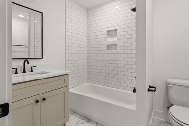 First floor bedroom with full bathroom *Photo not of actual home- construction to begin soon!!*