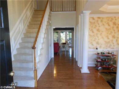Foyer - Two story foyer with hardwood floors, chai