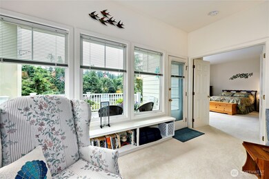 View of the creek and bay  and out the door to the large new Trex/Wolf deck. Primary bedroom through the double doors.