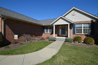 The front porch welcomes visitors and the bubbling fountain in the landscape bed provides a nice ambience.