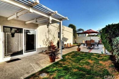 Covered Patio & Open Patio with Brick Ribbon Accents