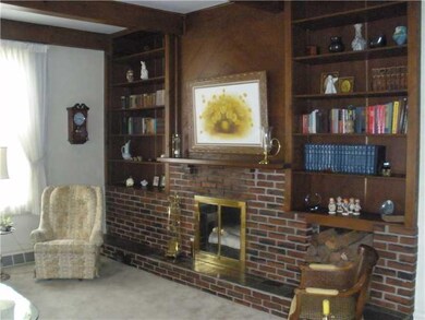 Living Room. Formal living room with built in shel