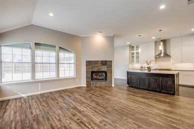 remodeled kiitchen with eat in island open to living and dining area