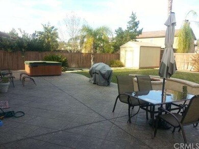 STAMPED CONCRETE PATIO WITH FIRE PIT AND HOT TUB