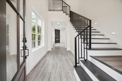 Wide open entryway with windows looking onto the s