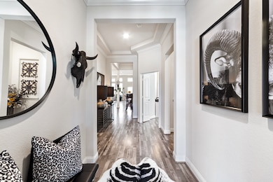 Upon entering this amazing home, you'll notice the bright walls, high ceilings, incredible wood-look laminate floors, crown molding & so much more!