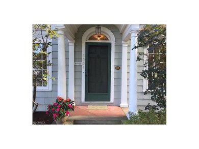 Inviting front porch with lovely leaded transom wi