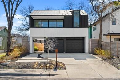 Contemporary house featuring driveway, board and 