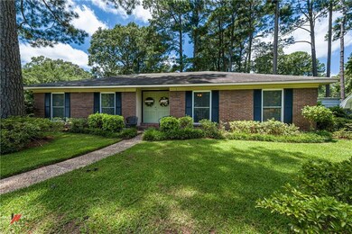 Mature landscaping and walkway to the front of the