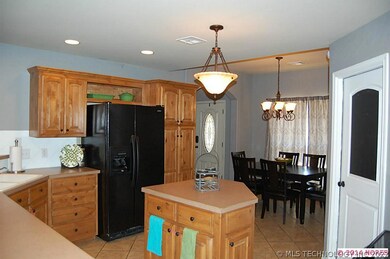 Large kitchen with island and eating bar.