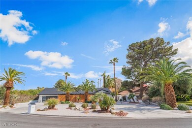 View of front of house featuring driveway, an atta