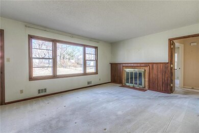 Living Room, with wood burning fireplace and large