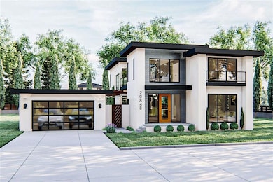 Contemporary home featuring a front yard, french d