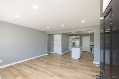Kitchen with open floor plan, light wood-style flo