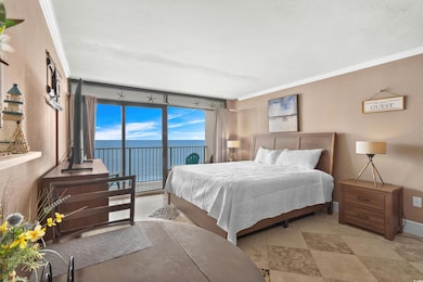 Bedroom with a textured wall, access to outside, and crown molding