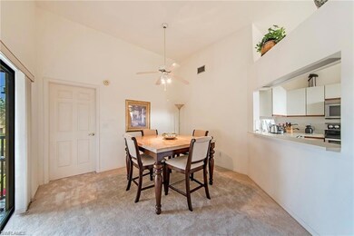 Dining area with ceiling fan, plenty of natural li