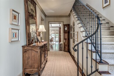Entrance hall with custom sea grass runner leads t