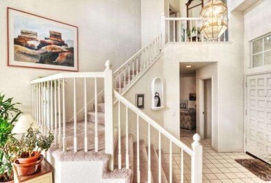 Beautiful entry way and wide staircase leading up 