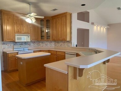 with island, plenty of cabinets, open to FR/DR