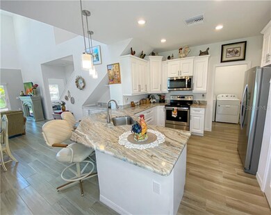 Large open kitchen, dining room and living room.