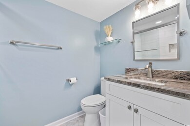 Full bathroom with vanity, a shower, and light tile patterned flooring