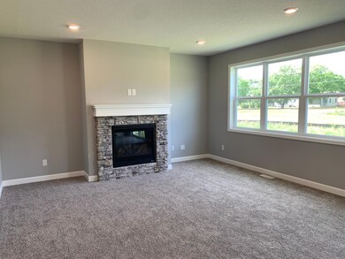 With three huge windows the living room will supply plenty of natural light. Model photo.